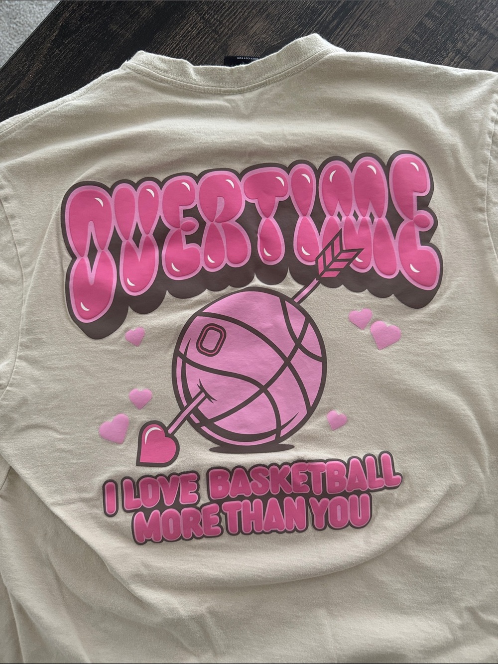 Men’s heavy duty Cotton Cream Graphic Tee with Pink Overtime logo.